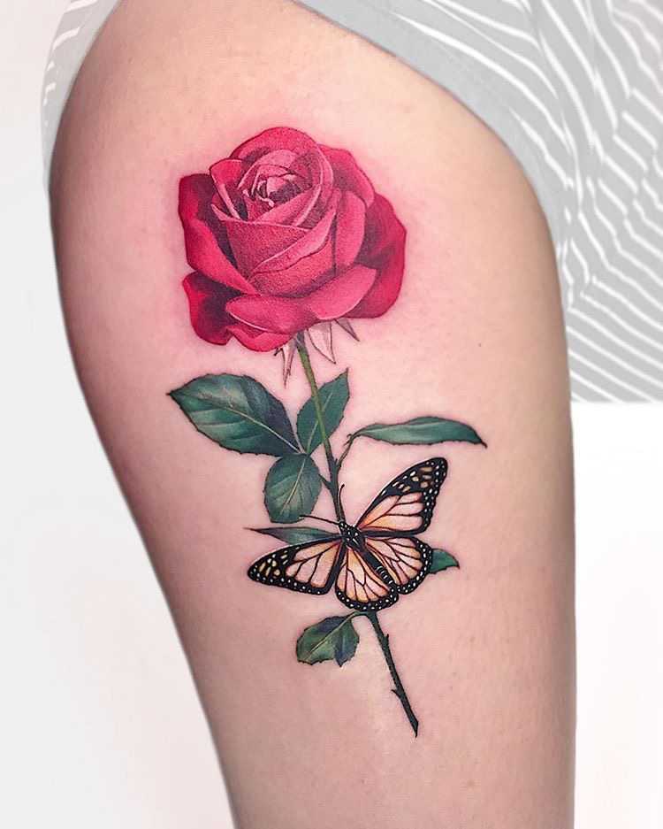 beautiful rose tattoo design with butterfly on arm
