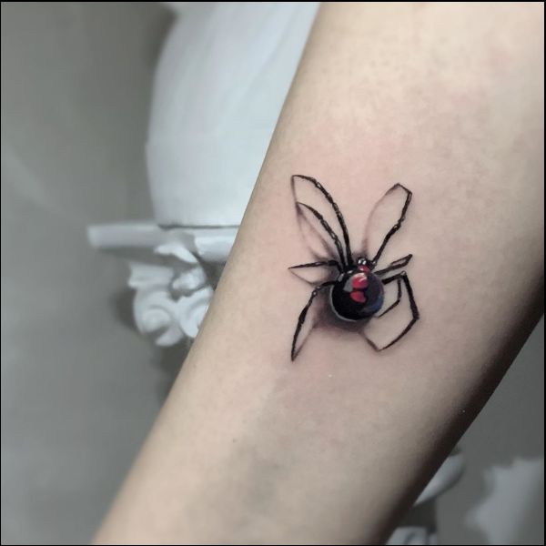 black widow tattoo reno on forearms