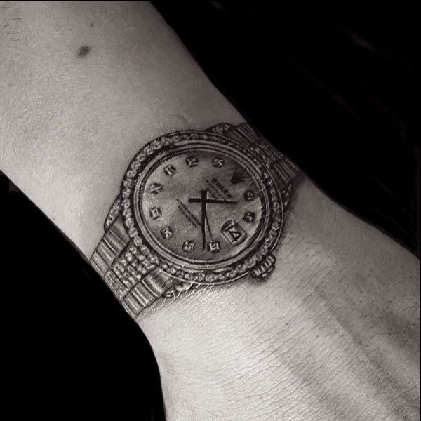 rolex with arm tattoos