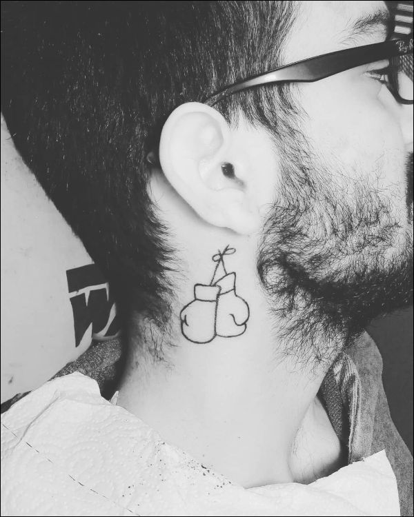 boxing gloves tattoo on neck