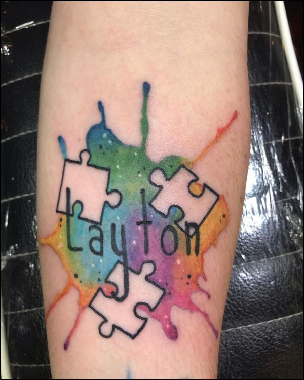 autism awareness puzzle peiece tattoo on wrist