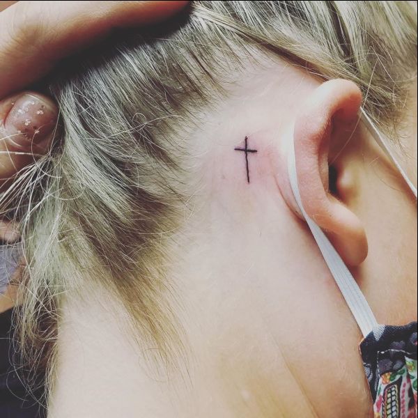 small cross tattoos behind the ear