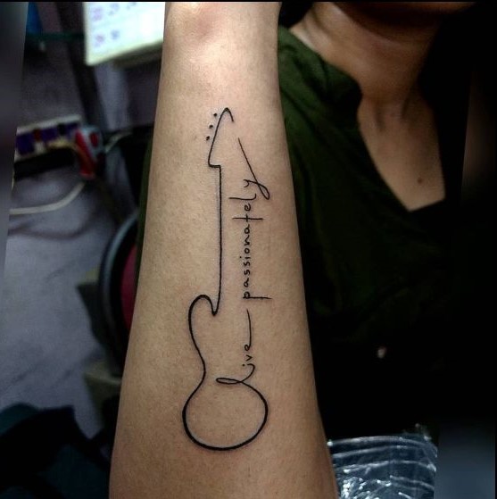 small music tattoo symbol on wrist