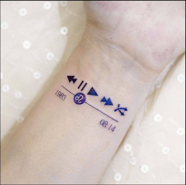 music play pause button tattoo on wrist