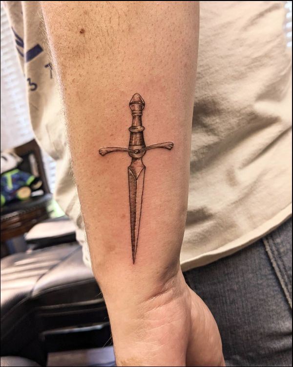 small sword tattoos on wrist