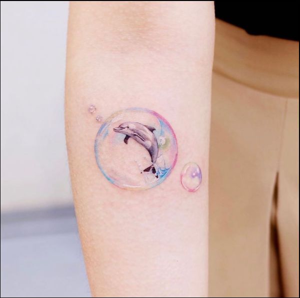 dolphin tattoos on the forearm