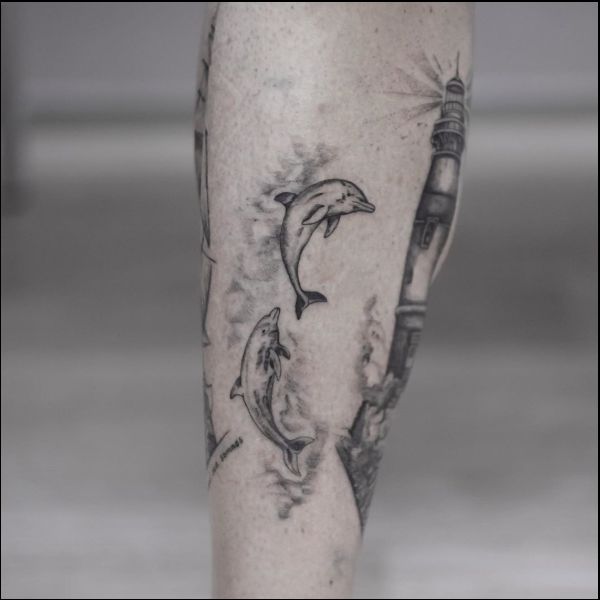 two dolphin tattoos