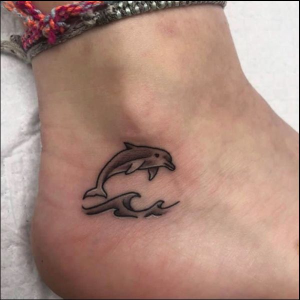 dolphin tattoos on foot