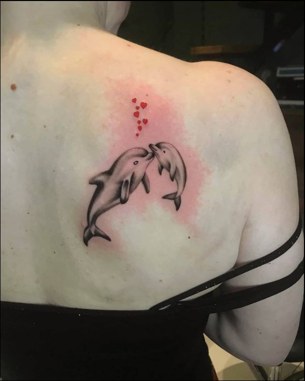dolphin tattoos on upper back