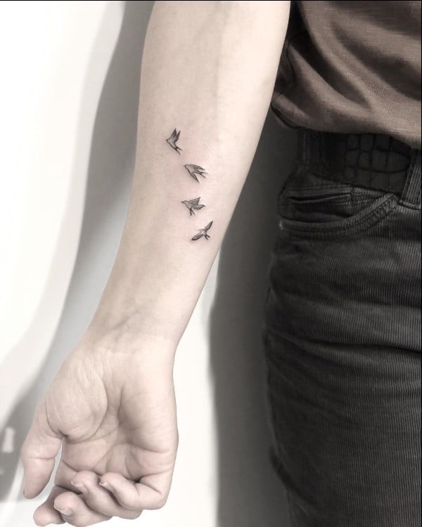 tiny bird tattoos on wrist