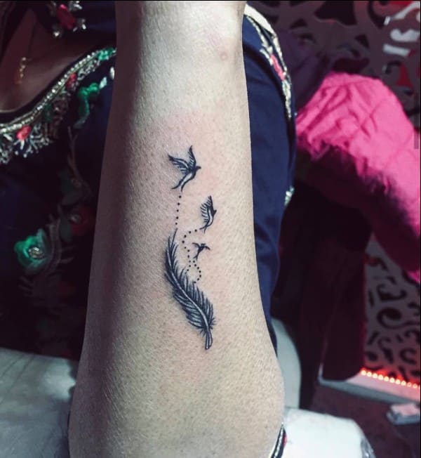 feather and bird tattoo