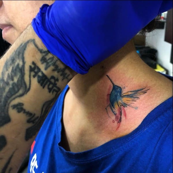 bird tattoo on neck