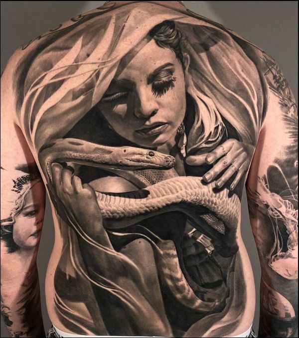 girl with snake on back tattoos