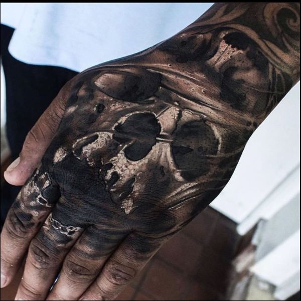 skull hand tattoos