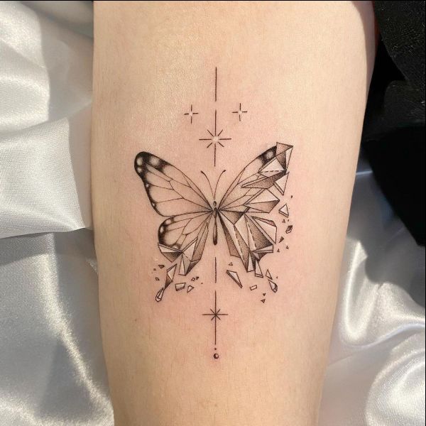 butterfly tattoos above the elbow