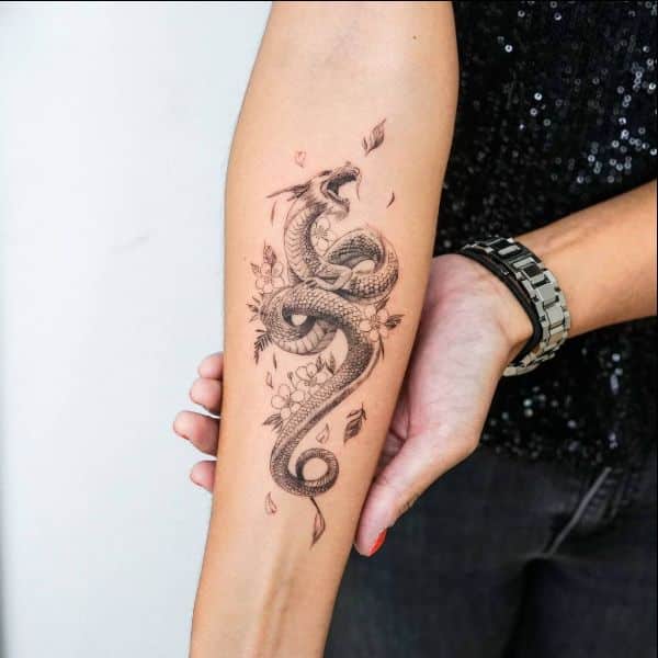 dragon tattoos around the arm