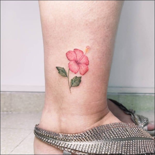 Amaryllis flower tattoo on leg