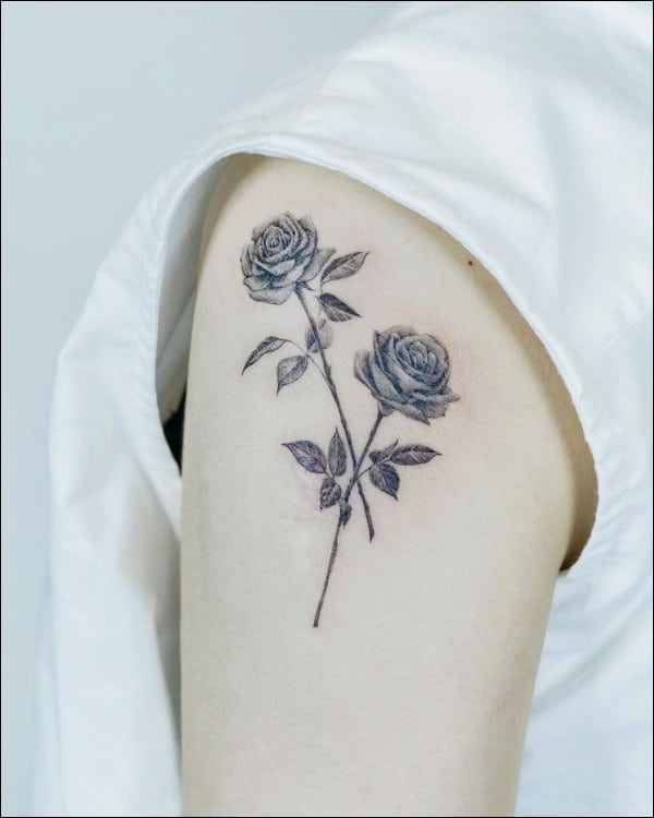 black and grey rose tattoos on arm