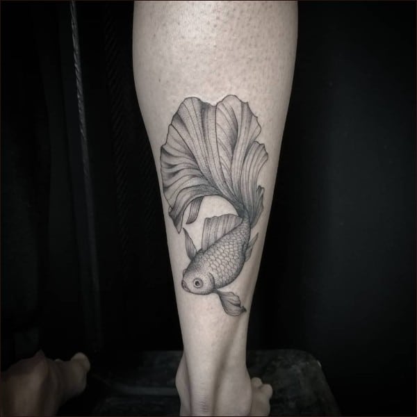 fish tattoo on legs