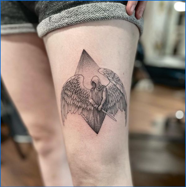 angel tattoos on thigh