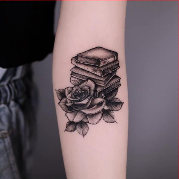 book tattoo on arms