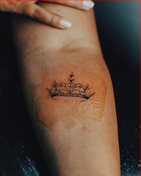 forearm crown tattoos