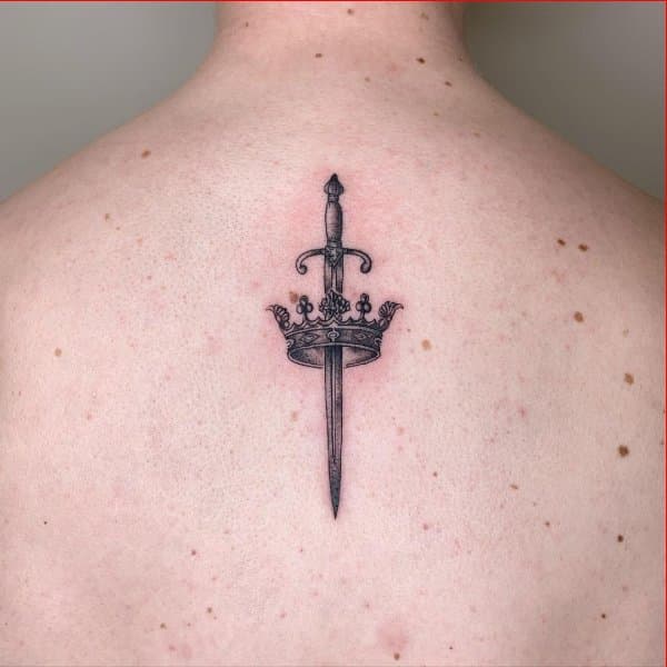 crown back tattoos with sword