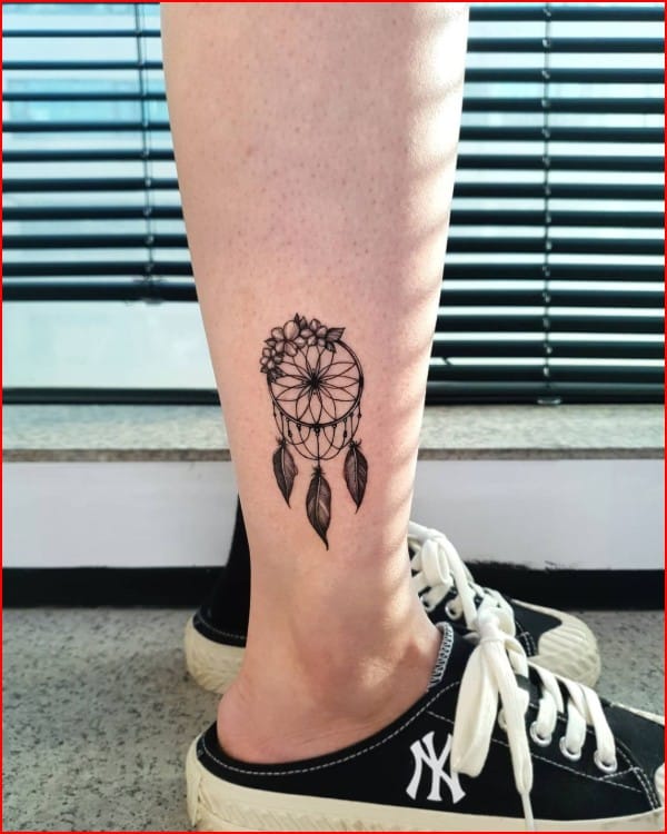dreamcatcher feathers tattoo on leg