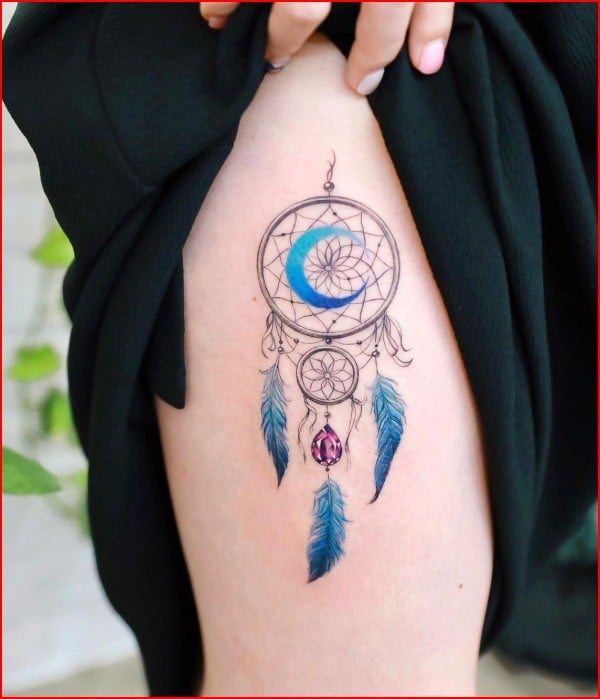 coloured dreamcatcher tattoos on thigh