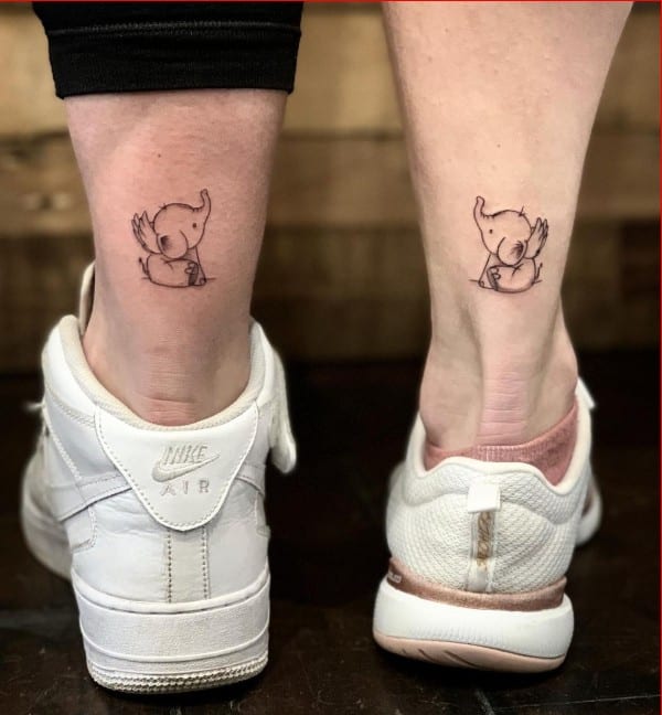 elephant matching tattoos on leg