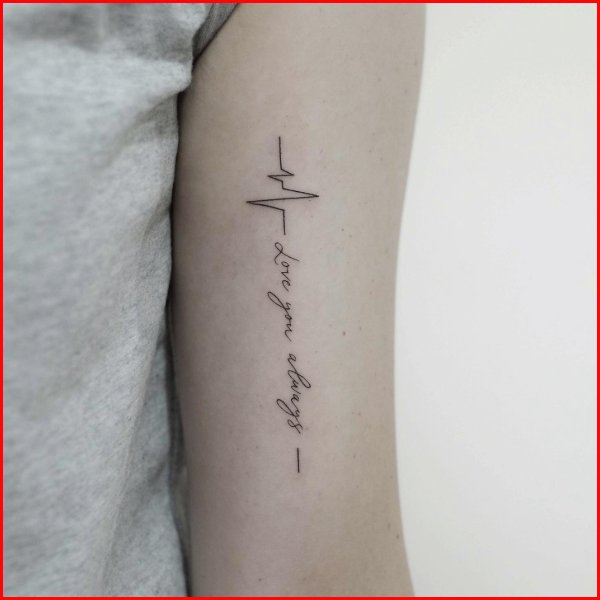 long heartbeat tattoo behind bicep
