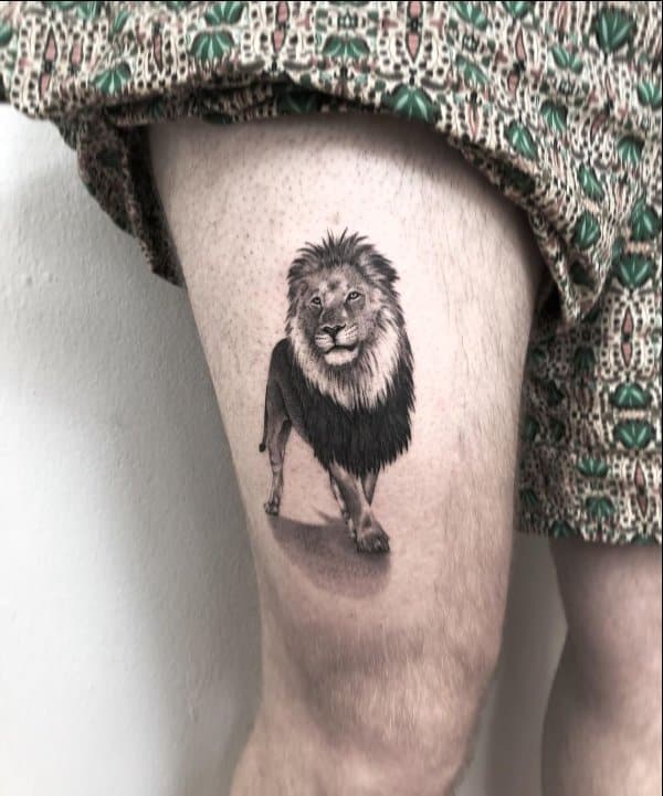 lion tattoo thigh