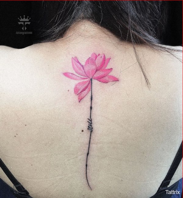 lotus tattoos on spine for women