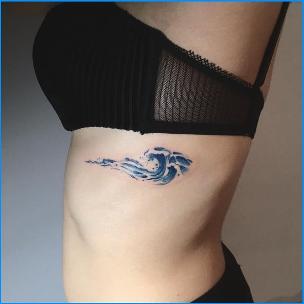 wave tattoos on ribs