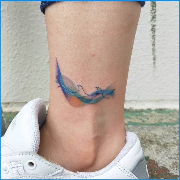 wave tattoos on leg