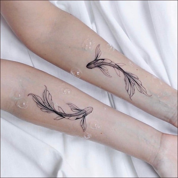 matching fish tattoos
