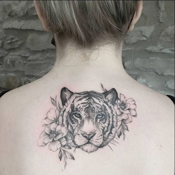 tiger head tattoo on back with flowers